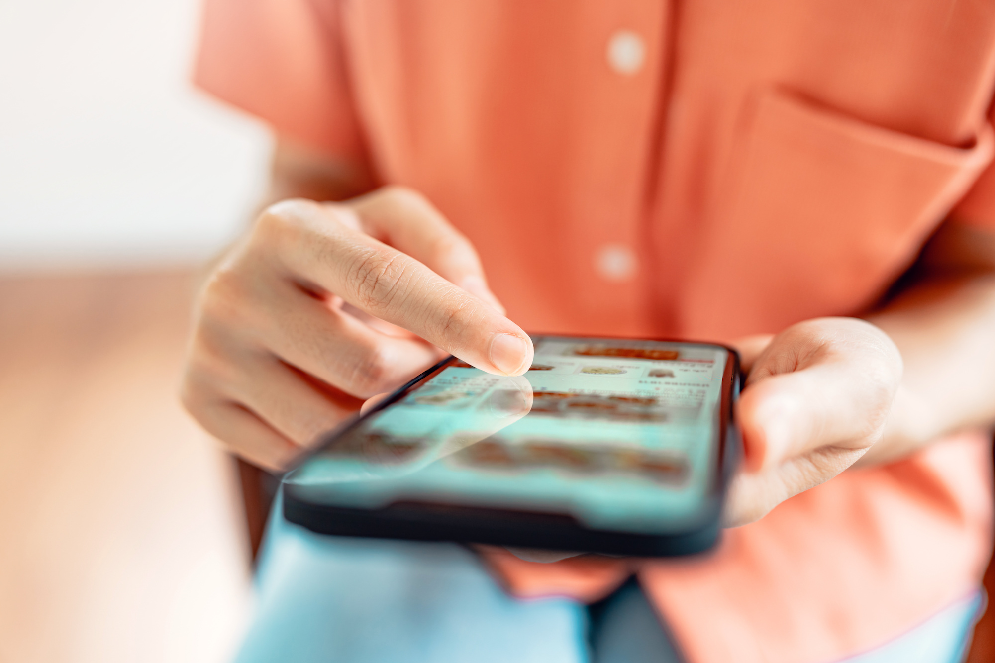 Woman browsing online store with wide variety of products available.