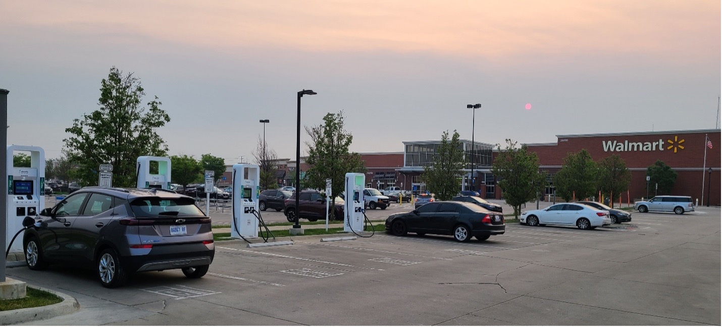 Chevy Bolt (on left) at charging station located in Walmart parking lot.