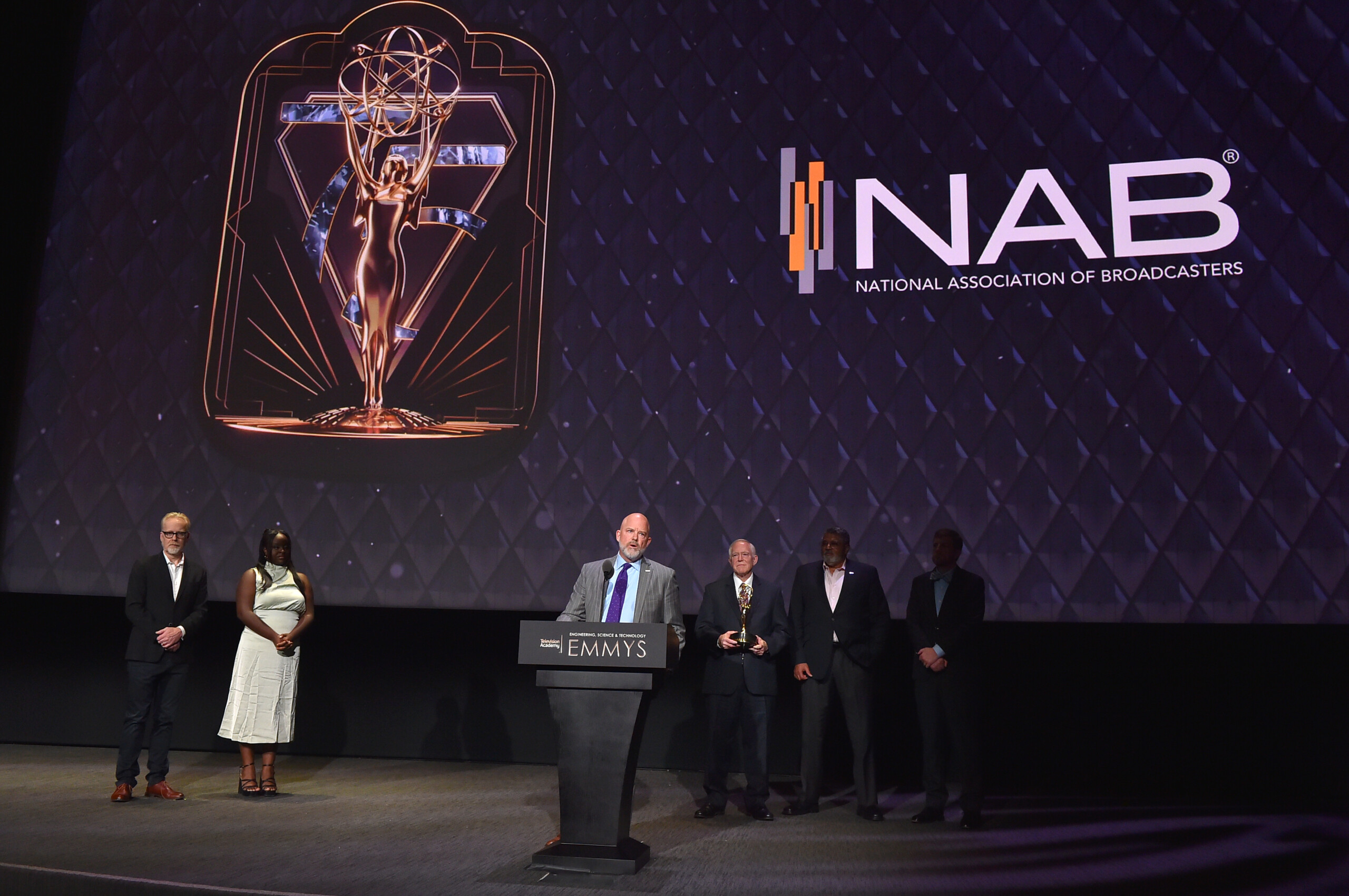 Sam Matheny from the National Association of Broadcasters (NAB) accepts the Philo T. Farnsworth Corporate Achievement Award given to the NAB at the 75th Engineering, Science & Technology Emmy Awards on Wednesday, October 18, 2023 onstage at the Television Academys Wolf Theatre in the Saban Media Center in Los Angeles, CA. (Photo by Jordan Strauss/Invision for The Television Academy/AP Images)