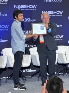 Vibhoothi, research assistant, Trinity College, Dublin, receiving the 2024 NAB Best Student Paper Award from Paul Shulins, president, IEEE.